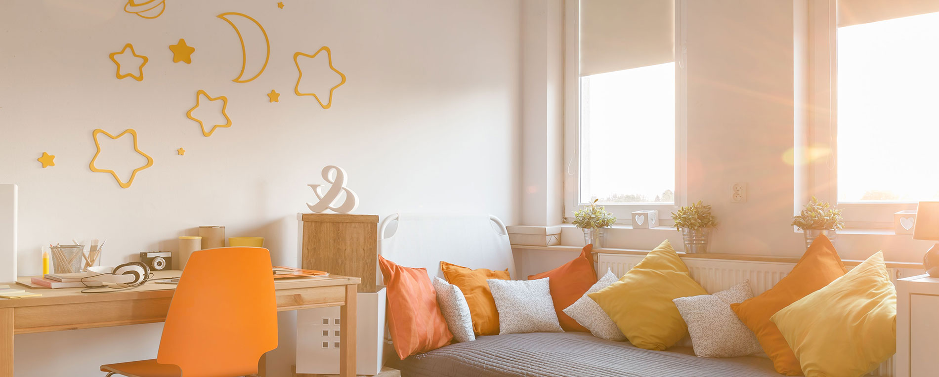 A view at a light modern teenager's room with blackout roller shades